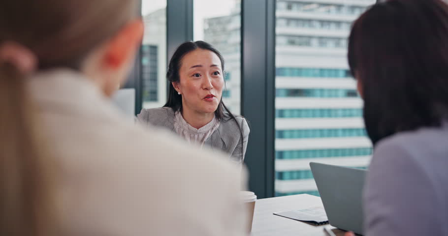 Business woman, meeting and notes with tablet for B2B, contract or conversation at office. Japanese manager, Hr officer and employees talking with candidates for partnership or career opportunity