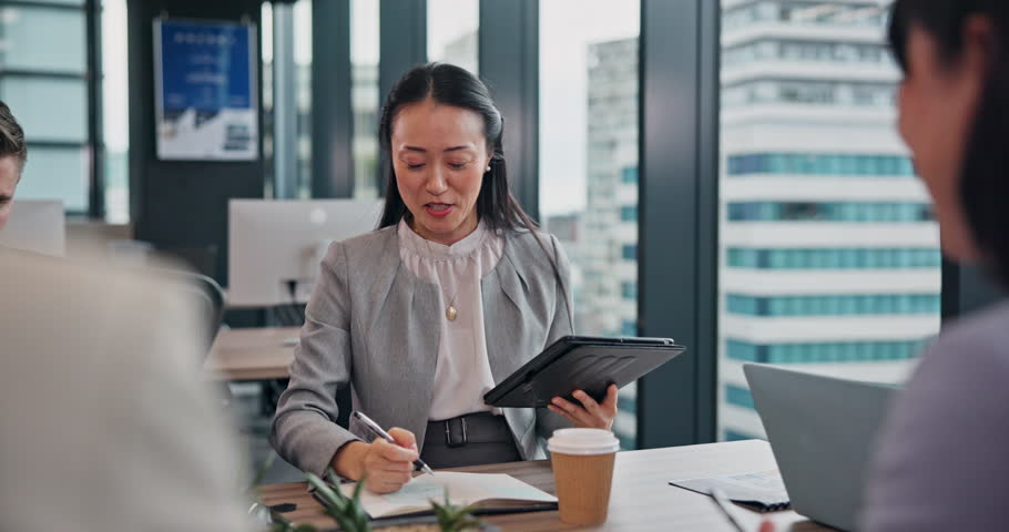 Business woman, meeting and notes with tablet for B2B, contract or conversation at office. Japanese manager, Hr officer and employees talking with candidates for partnership or career opportunity