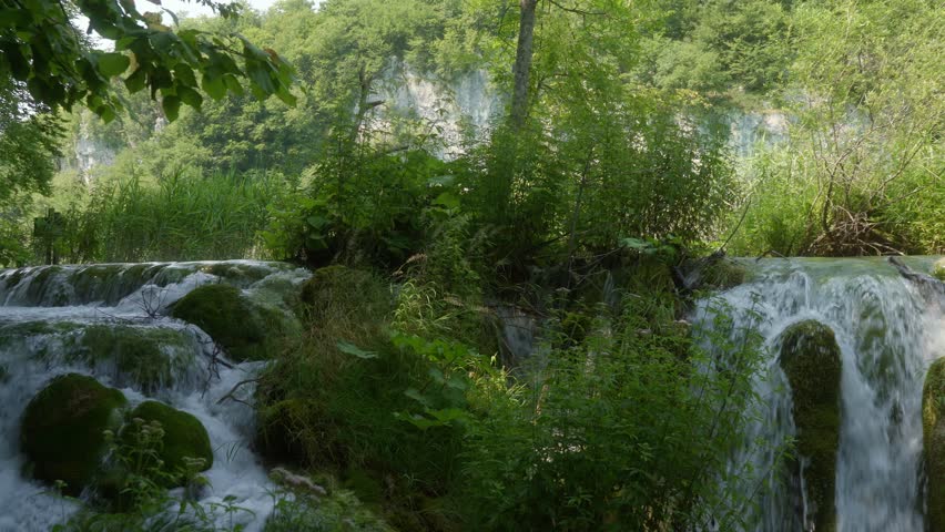 A waterfall with clear water in the famous Croatian Plitvice Lakes National Park, listed as a UNESCO World Heritage site. A popular natural tourist attraction in Croatia.