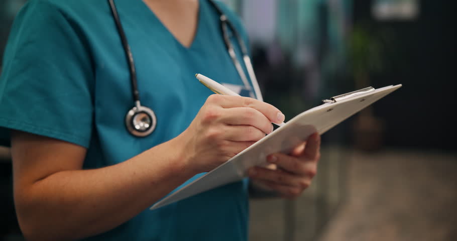 Person, nurse and hands writing with document for medical prescription, patient records or inusrance at hospital. Japan, closeup or doctor with notes or filling health form, survey or application