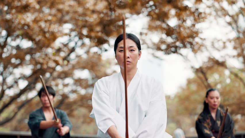 Nature, people and training with bamboo for martial arts, practice skill and kendo with Japanese sport. Bridge, sensei or samurai students with wood sword for fighting technique, action or discipline