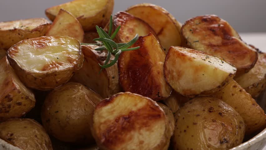 roasted potatoes tclose up in bowl rotation food