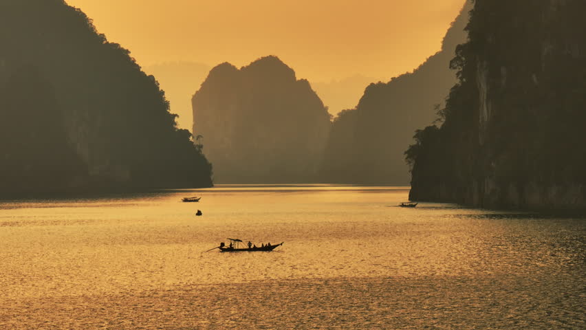Aerial view drone fly orbiting over boat on the lake of Khao Sok national park, Thailand
