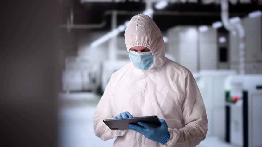Factory Clean Room Laboratory. Industrial Engineer Using Technology
