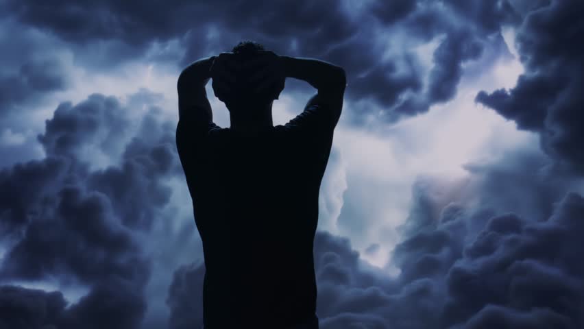 Silhouetted Figure Against Dramatic Storm Clouds Mental Health Stress Anxiety Depression