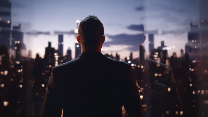 Silhouetted Business Executive Overlooking City Skyline At Twilight Urban Success Achievement