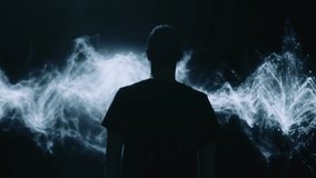 Silhouetted Figure Standing Before Ethereal Smoke Waves Dark Atmosphere Mystic Artistic - Powered by Shutterstock - Get 15% off with code: PIKWIZARD15