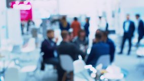 Unrecognizable people who are holding a business meeting or negotiation. Blurry defocused video. Business theme background. - Powered by Shutterstock - Get 15% off with code: PIKWIZARD15
