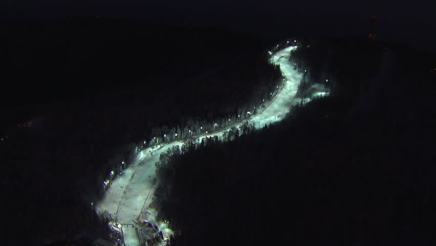 Aerial shot of illuminated ski track at night, Medvednica, peak Sljeme