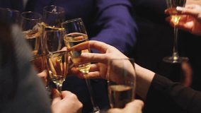 Group of businessmen celebrate, closing successful concluded deal, guests clinking raise glasses with alcohol, sparkling wine, toasting and cheering, colleagues team in office on corporate party event - Powered by Shutterstock - Get 15% off with code: PIKWIZARD15