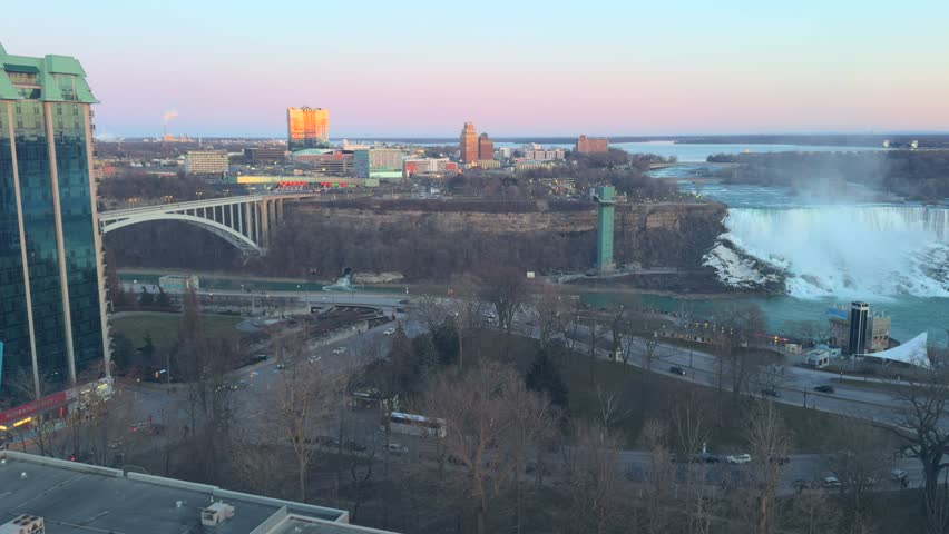 Part of Niagara Falls and view of the USA from above during golden hour, beautiful sunset.