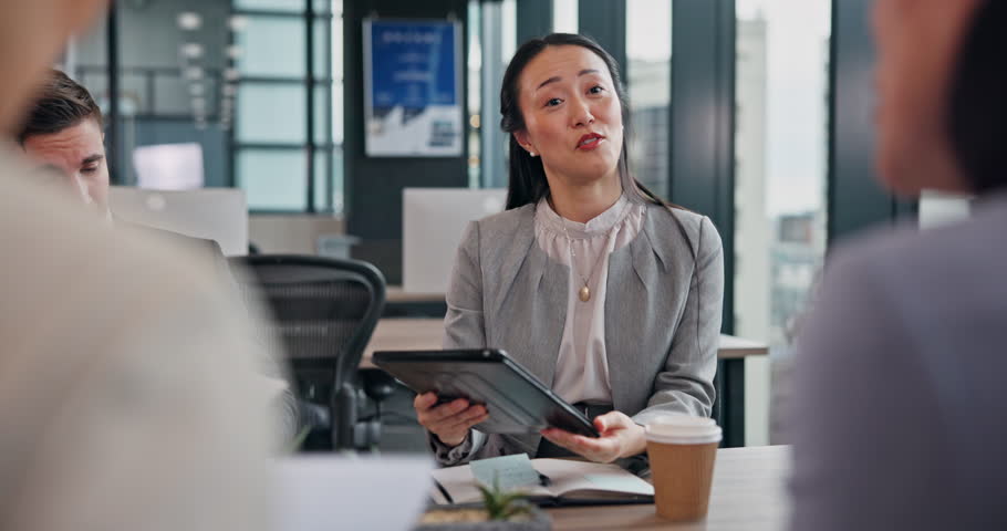 Business woman, meeting and interview with tablet for B2B, contract or conversation at office. Japanese manager, Hr officer and employees talking with candidates for partnership or career opportunity