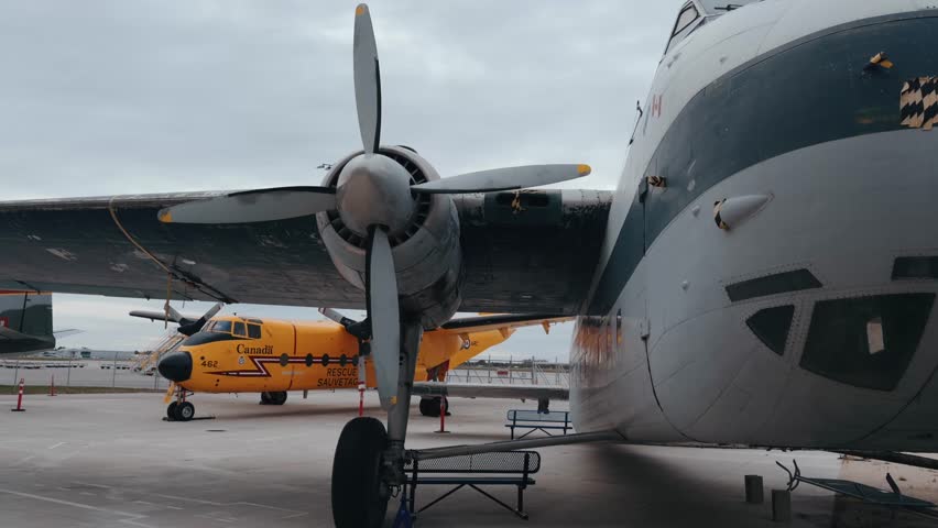 Old plane at the Manitoba Aviation Museum. Old plane in storage, passenger plane in cloudy weather.