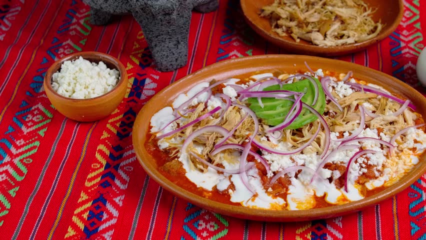 Red chilaquiles, a typical mexican breakfast, Mexican food, Mexican chilaquiles, camera movement left to right