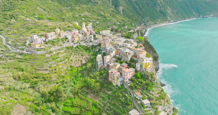 Aerial drone landscape of Corniglia, Italy Colorful Cliffside Town the Seaside Mountainous of famous Cinque Terre, Liguria, Northern Italia on Tyrrhenian sea in summer day. Coastal travel village.