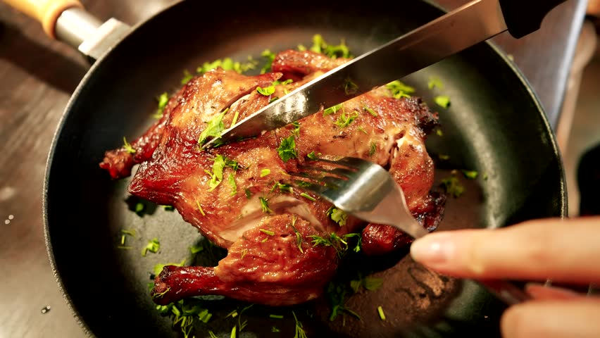 Roast Chicken Being Carved. Tasty Meat. holiday dinner. Roasted chicken meat for dinner. Hot Food At Dinner. dish family dinner or lunch Christmas New Year Thanksgiving. Mouthwatering Roast Chicken