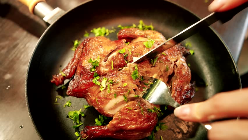 Roast Chicken Being Carved. Tasty Meat. holiday dinner. Roasted chicken meat for dinner. Hot Food At Dinner. dish family dinner or lunch Christmas New Year Thanksgiving. Mouthwatering Roast Chicken