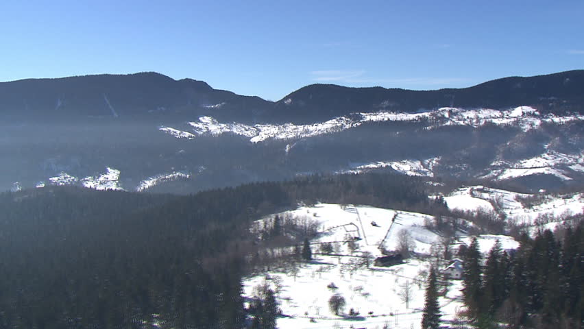 Aerial shot of the mountain Jahorina covered by snow in a bright day