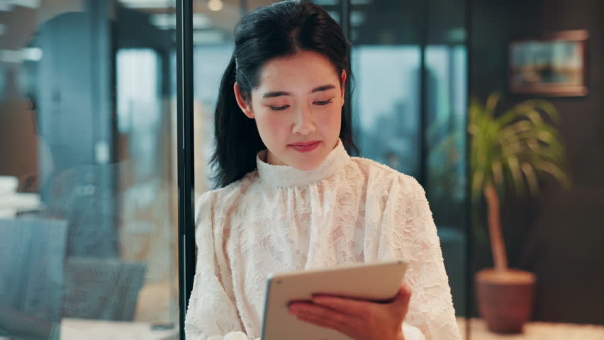 Japanese, corporate and girl with tablet in office for schedule planning, communication and feedback. Accountant, woman and digital app with information, budget and negotiation for proposal in Japan - Powered by Shutterstock - Get 15% off with code: PIKWIZARD15
