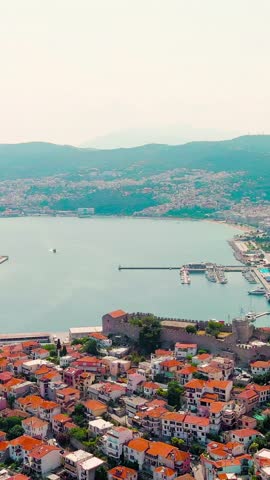 Vertical video. Kavala, Greece. Kavala Fortress. Historic city center. Aegean Sea. Summer, Aerial View. Rich colors