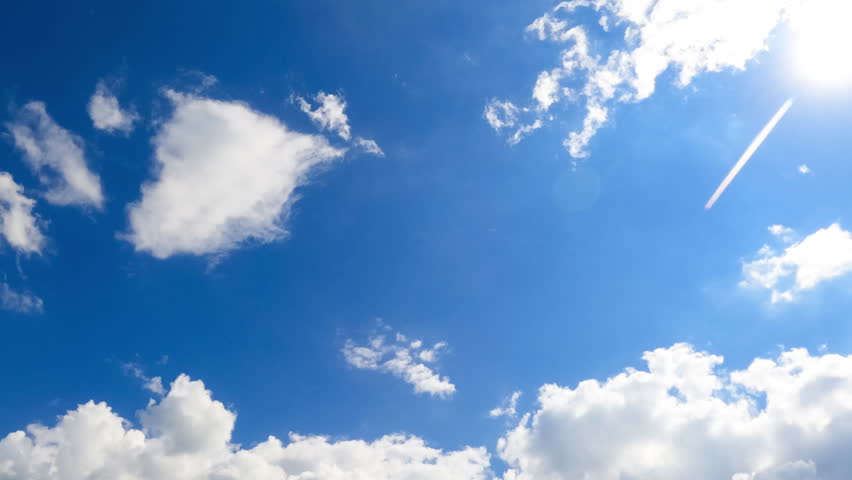 Soft light clouds transform quickly into the grey ones. Low angle view at the storm formation in the atmosphere. Timelapse.