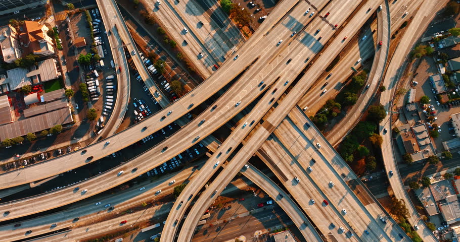 Highways and freeways with automobiles driving on. Complicated road system of Los Angeles, California, USA. Top view.
