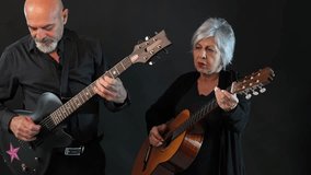 Senior man playing spanish guitar at home balcony - Powered by Shutterstock - Get 15% off with code: PIKWIZARD15