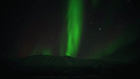 Aurora Borealis Moving Beneath a Starry Night Sky Over Mountain In Iceland - Powered by Shutterstock - Get 15% off with code: PIKWIZARD15