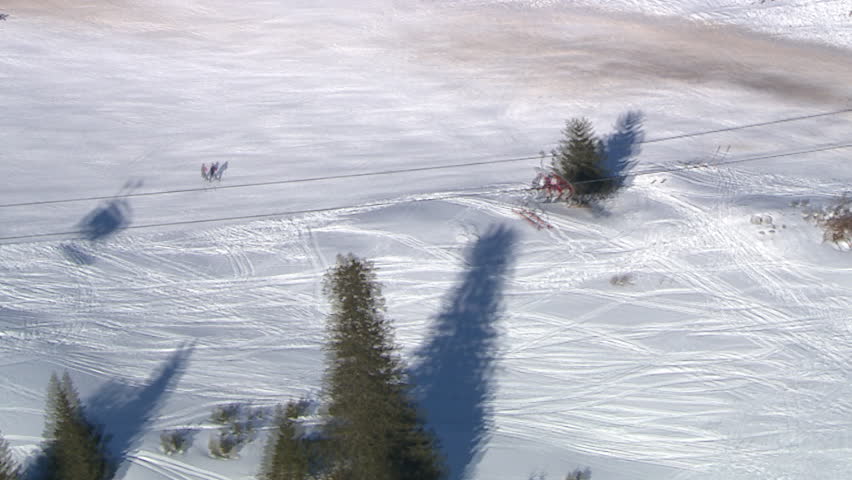 Aerial helicopter shot of cable cars and hotel on mountain Jahorina