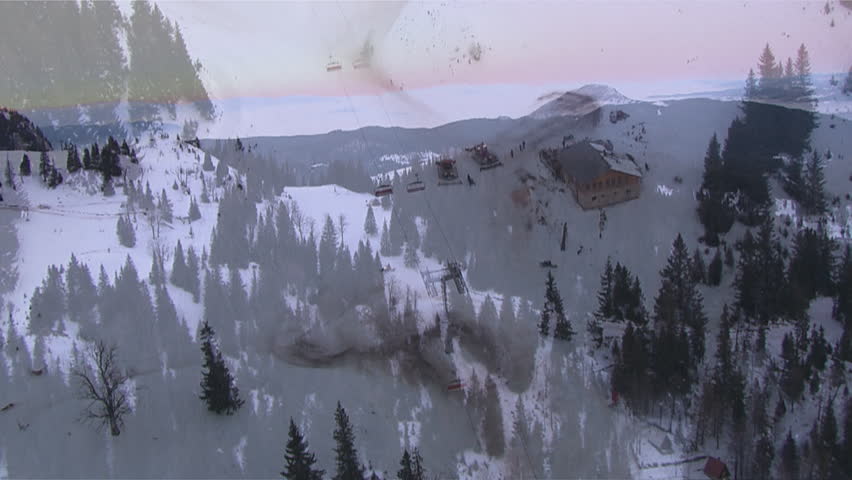 Aerial helicopter shot of snowmobiles on the mountain of Jahorina