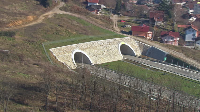 Aerial shot of two tunnels on a highway