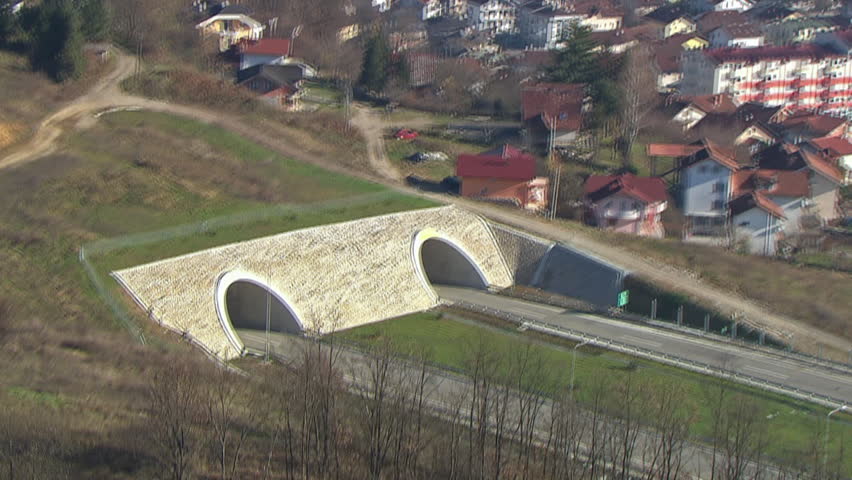 Aerial shot of two tunnels on a highway