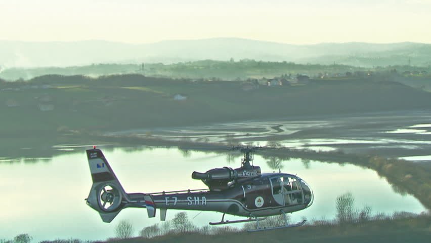 Aerial shot of a helicopter flying over the waterlands