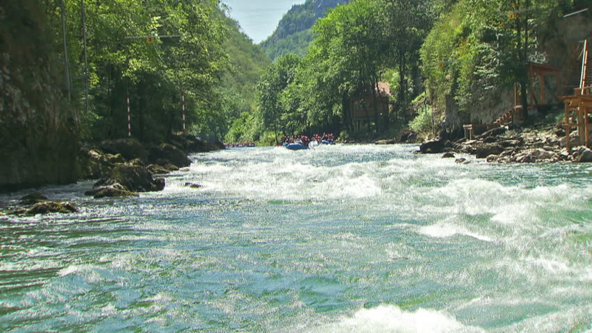 Crane shot of rafting on a wild river