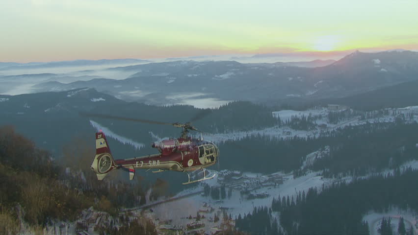 Aerial helicopter shot of the sunset over the mountain Jahorina