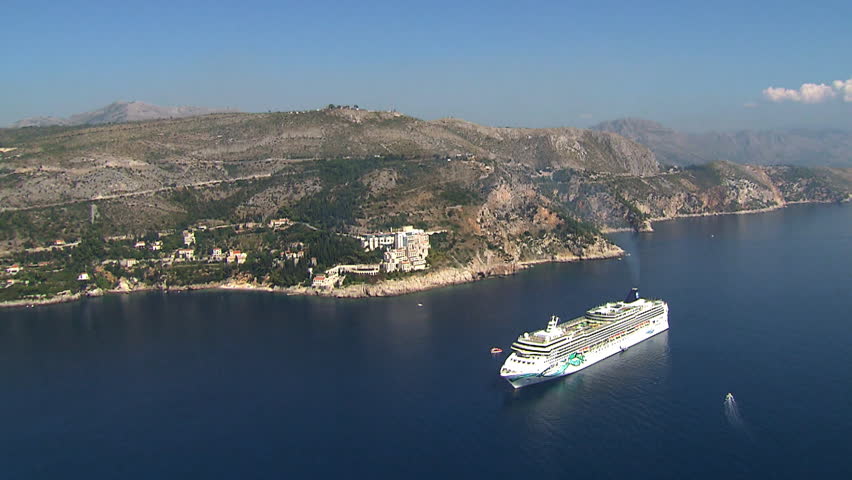 A big cruise ship in the waters of Dubrovnik, Adriatic sea. Aerial helicopter