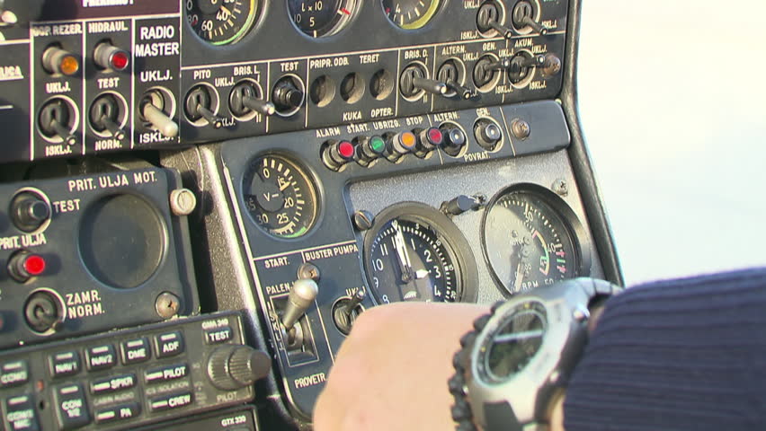 A pilot and helicopter knobs