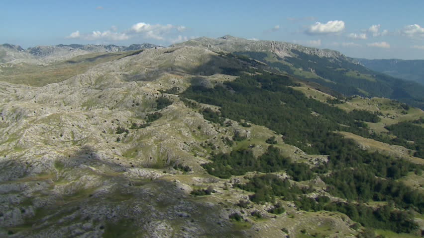 Aerial shot of green slopes of the Dinaric Alps, Bosnia Herzegovina