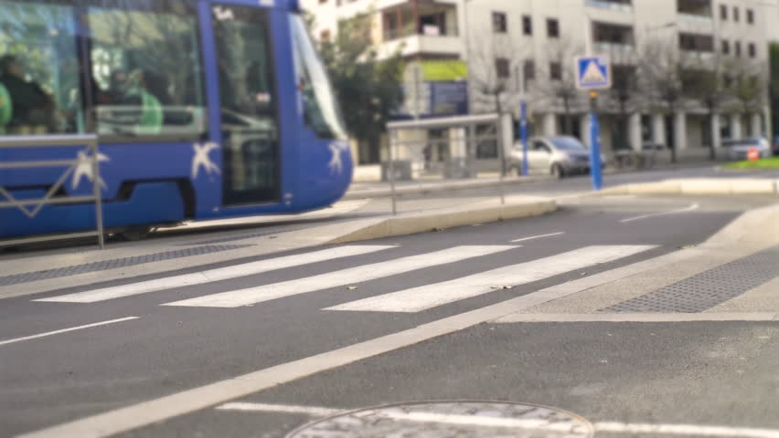 person with a low carbon footprint taking the French public transport tramway in Montpellier. High quality 4k footage