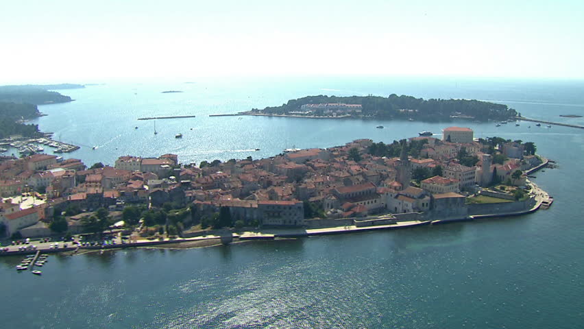 Aerial shot of the City of Porec (Pore\xE8) with a marina and the small island of Saint Nicholas, Istria County