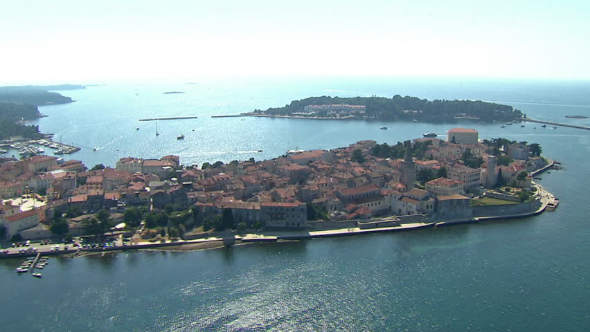 Aerial shot of the City of Porec (Pore\xE8) with a marina and the small island