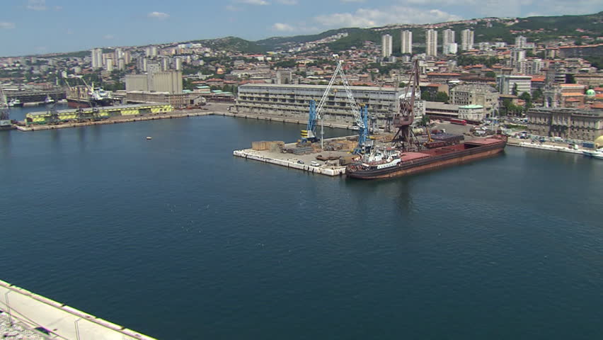 Aerial shot of a cargo ship docked in the port of Rijeka