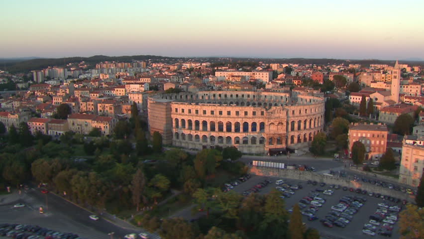 Aerial helicopter shot of the Arena of Pula at sunset, Istria, Croatia