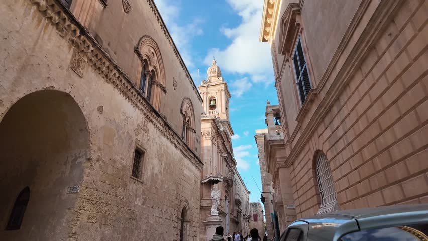 The statue of Our Lady of Mount Carmel in Medina And Bell tower of Church of the Annunciation of Our Lady. Hyperlapse. High quality 4k footage