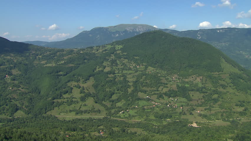 A spectacular aerial of green slopes of Dinaric Alps
