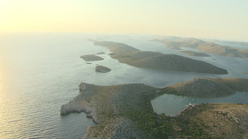 Flying slowly over beautiful Kornati islands' landscape at sunset, Adriatic sea.