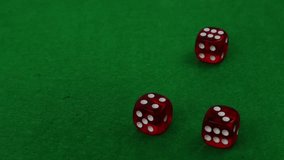Three casino dice falling on a green table close-up, slow motion - Powered by Shutterstock - Get 15% off with code: PIKWIZARD15