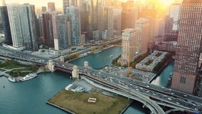 Chicago bridge and skyline at sunset with lens flare. Aerial view of Chicago's bridge and downtown buildings at sunset, with warm lens flare highlighting the urban architecture and river. - Powered by Shutterstock - Get 15% off with code: PIKWIZARD15