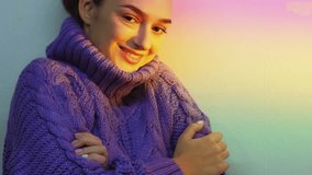 Cozy tranquility. Morning inspiration. Sweater comfort. Relaxed satisfied woman enjoying stretching on pastel blur rainbow light colorful gradient background. - Powered by Shutterstock - Get 15% off with code: PIKWIZARD15