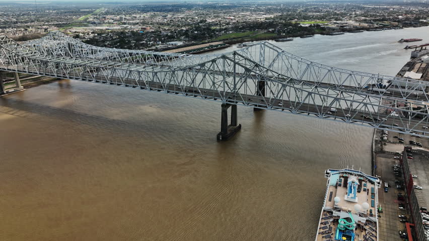A stunning aerial view of a majestic bridge spanning across a picturesque river in New Orleans